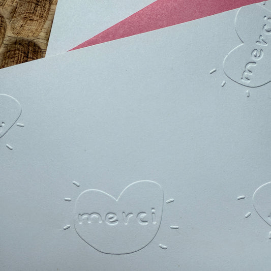 Timbre à sec motif Merci