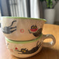 Tasse céramique modelée et peinte à la main – Felix mange une pastèque